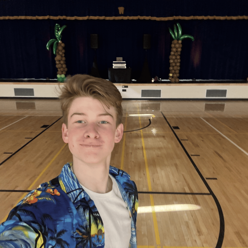 Photo with DJ Mason Mueller in front of his setup.
